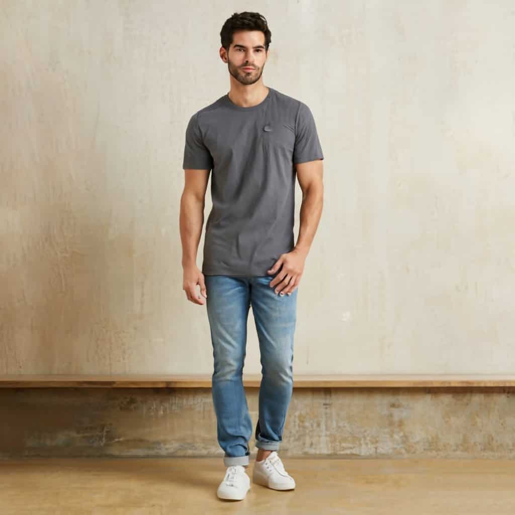 Model wearing dark coloed t-shirt with faded jeans.